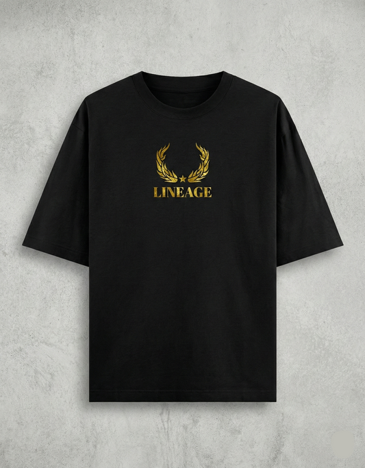 Flat lay of black tee with gold Lineage text on chest.