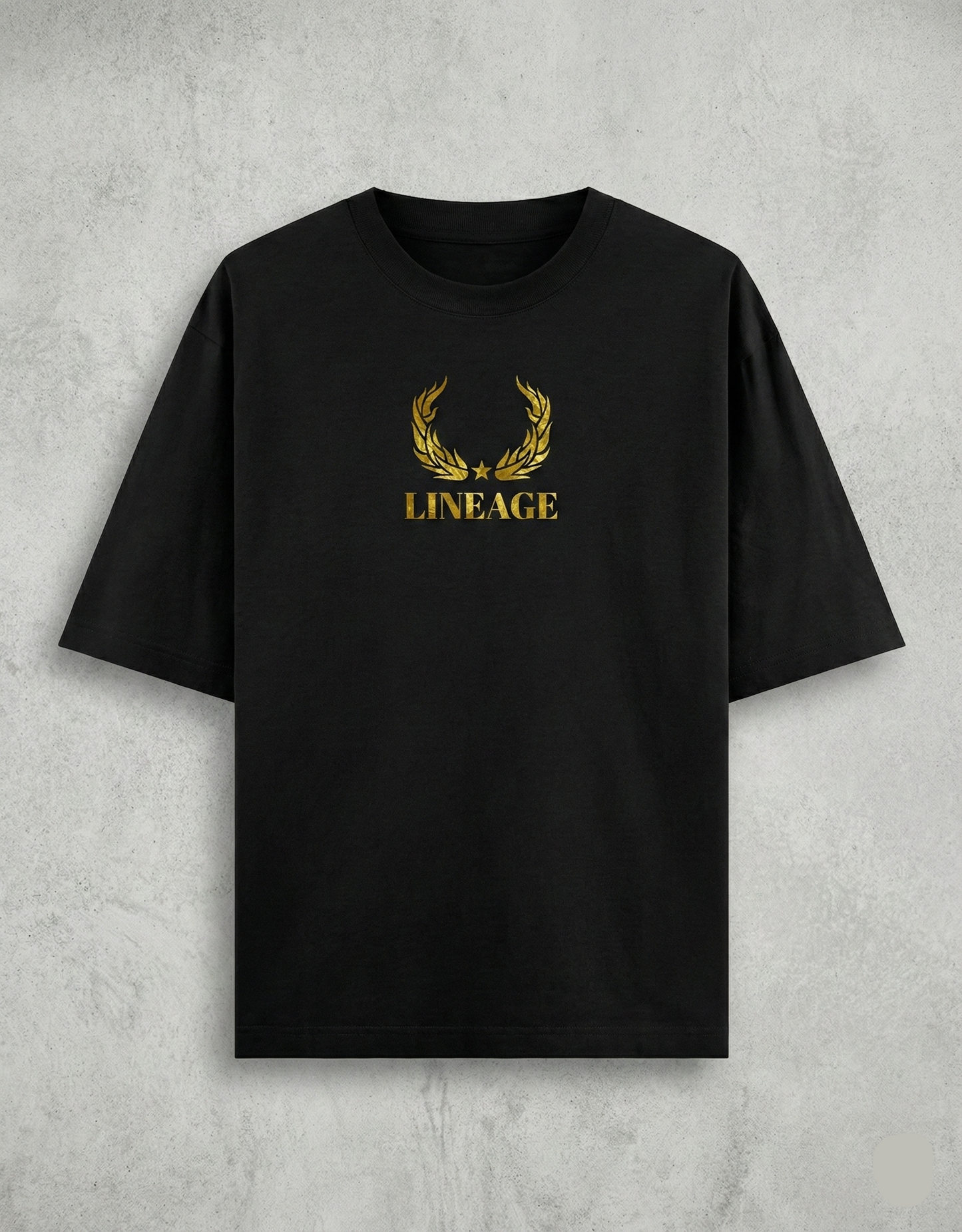 Flat lay of black tee with gold Lineage text on chest.