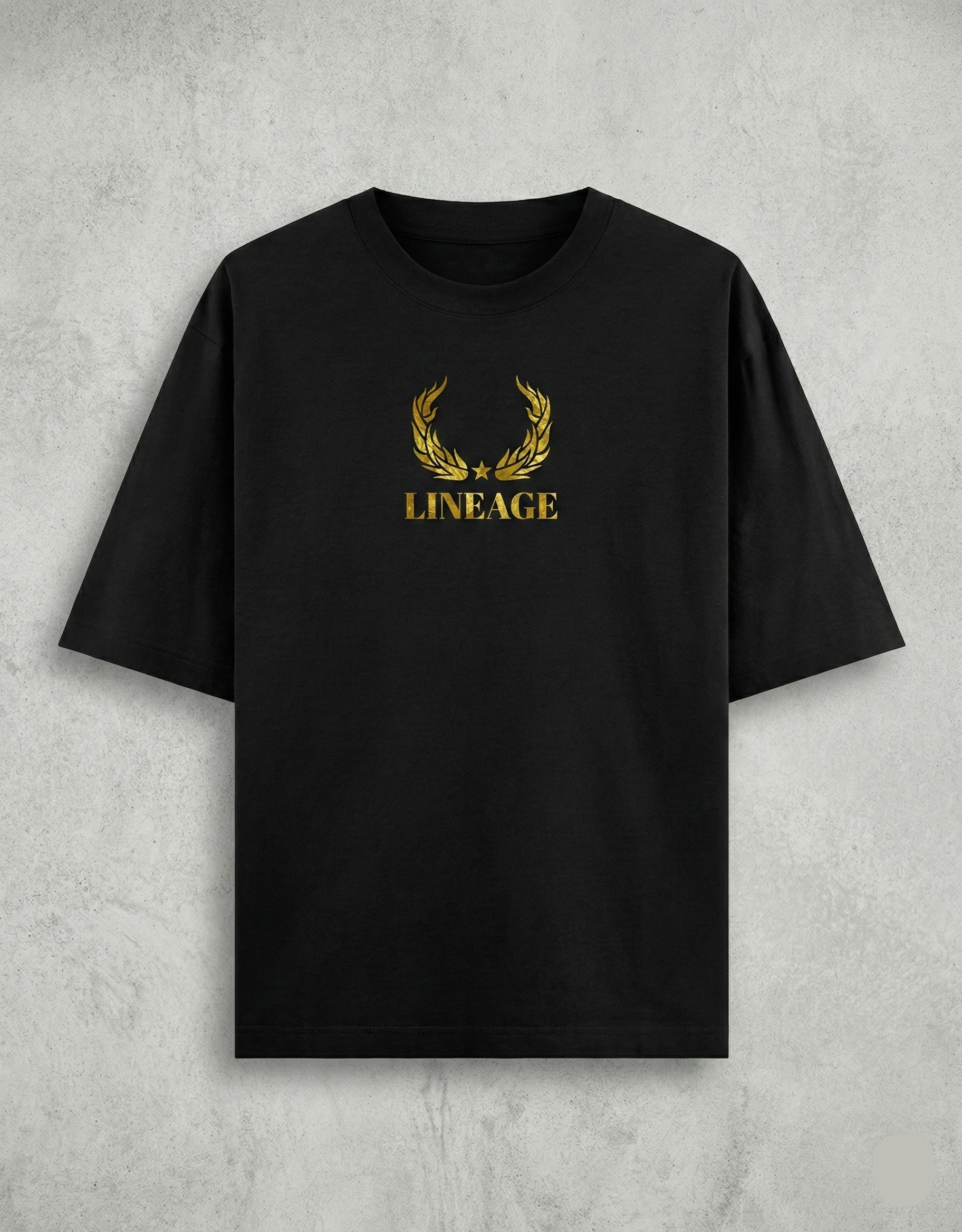 Flat lay of black tee with gold Lineage text on chest.