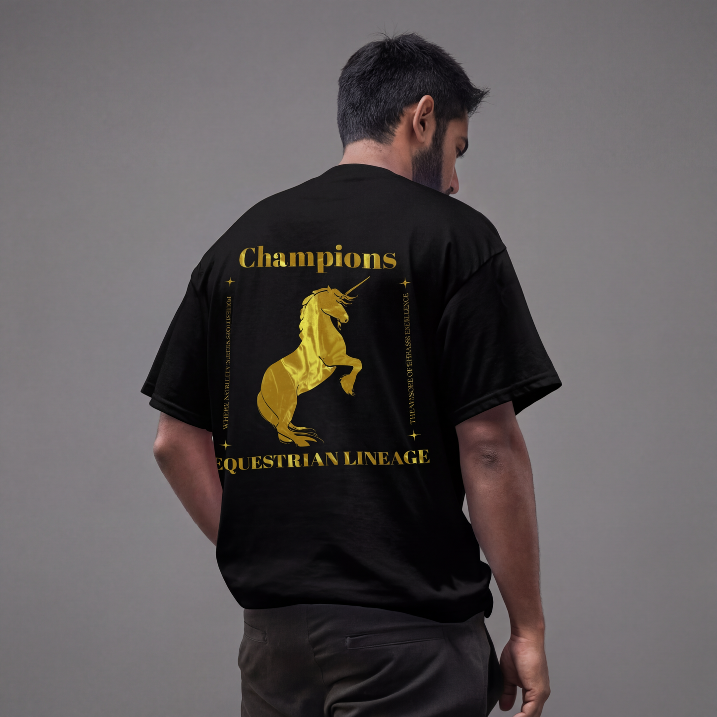 Model wearing black oversized tee with gold horse design on back.