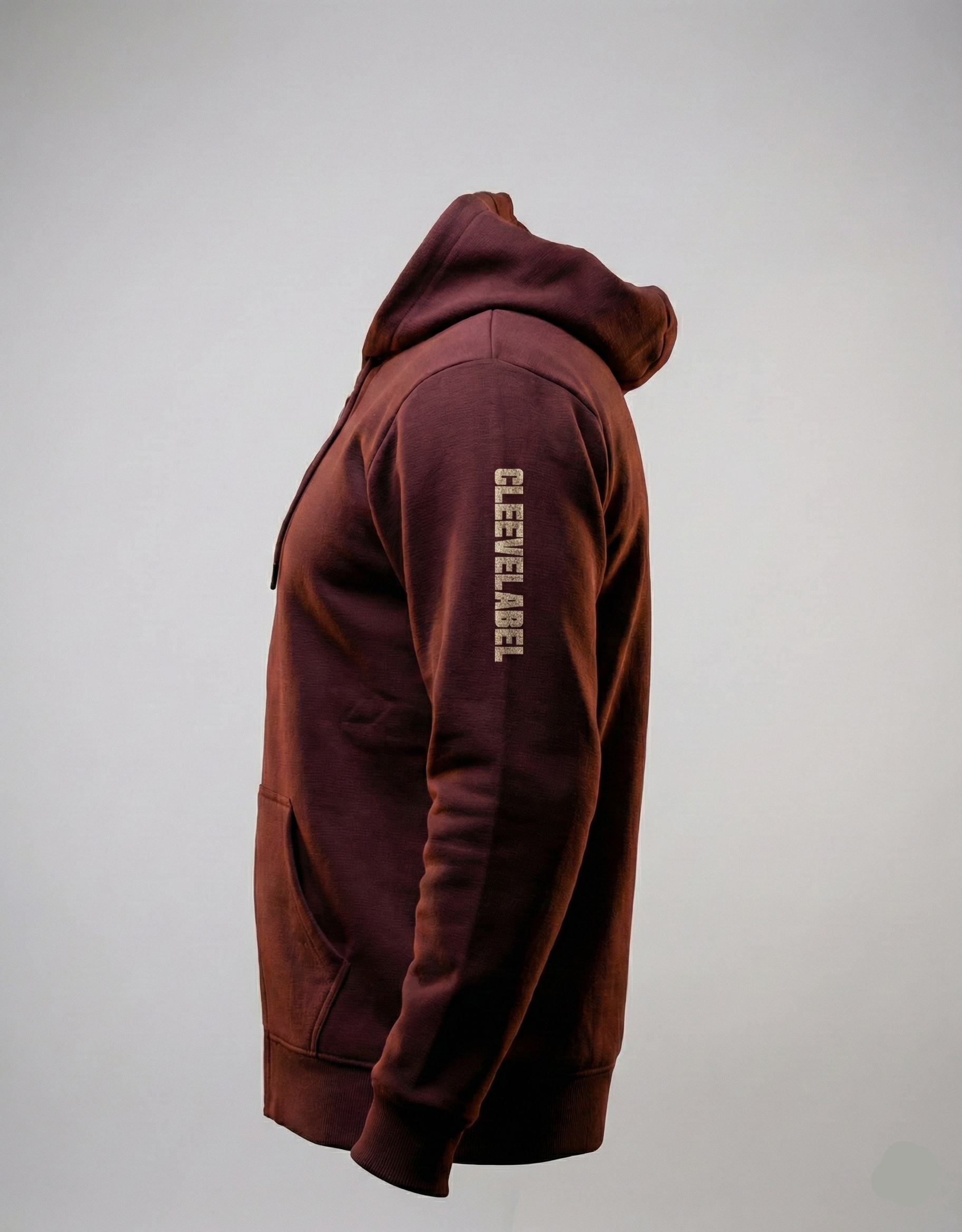 Maroon Street Artistry hoodie side view highlighting sleeve branding.