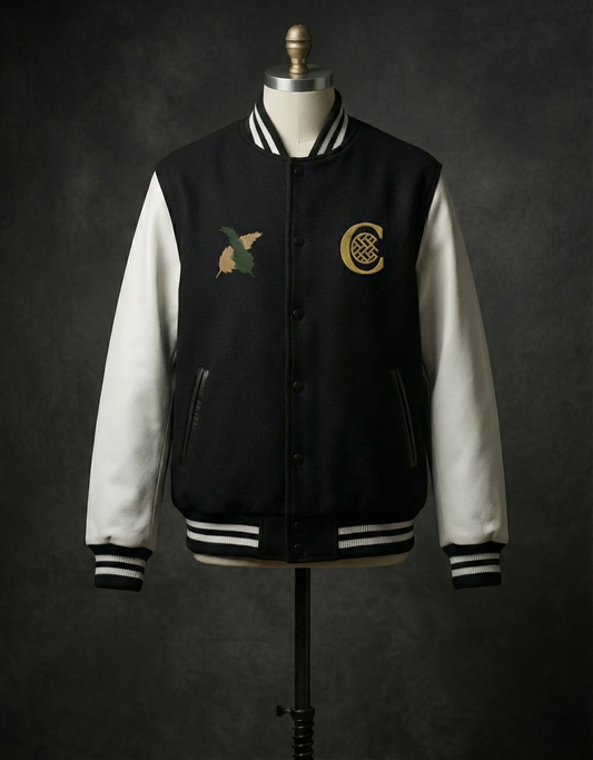 Black and white varsity jacket on mannequin with front logos.