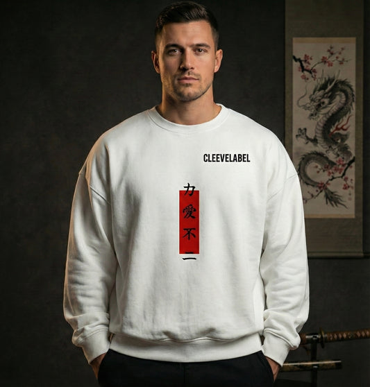 White warrior oversized sweatshirt front worn by male model – vertical red kanji design and Cleevelabel branding, luxury dark studio aesthetic.