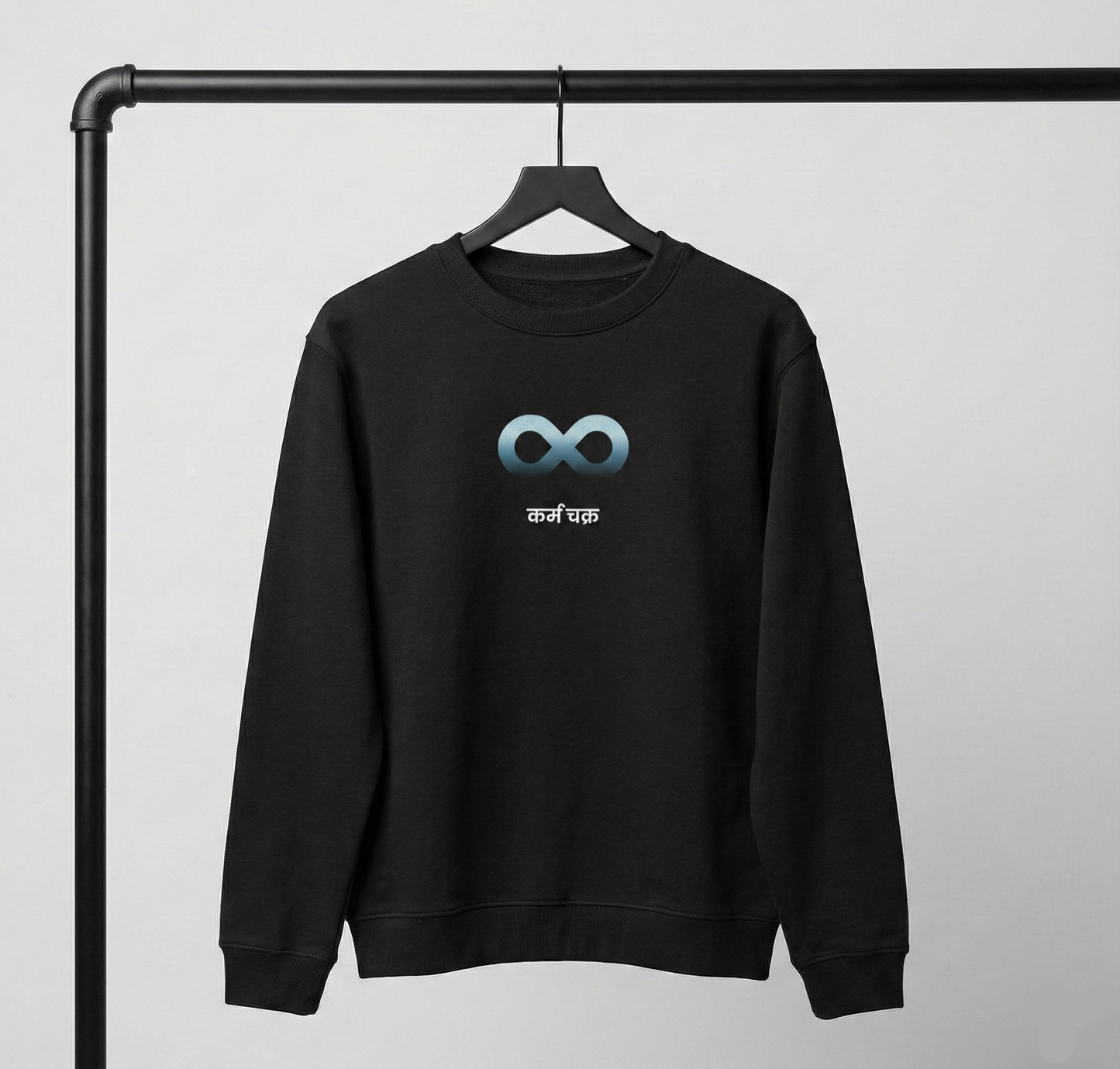 Black Karma sweatshirt on hanger with infinity symbol graphic on front.