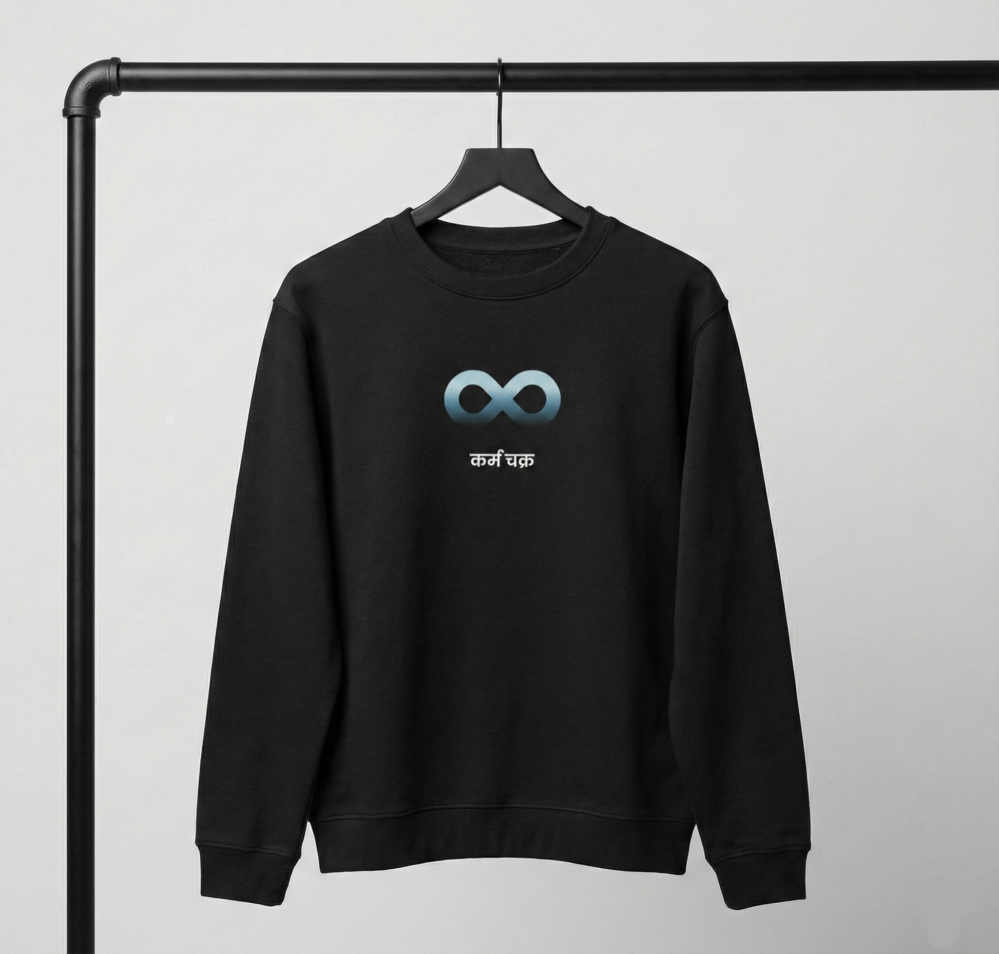 Black Karma sweatshirt on hanger with infinity symbol graphic on front.
